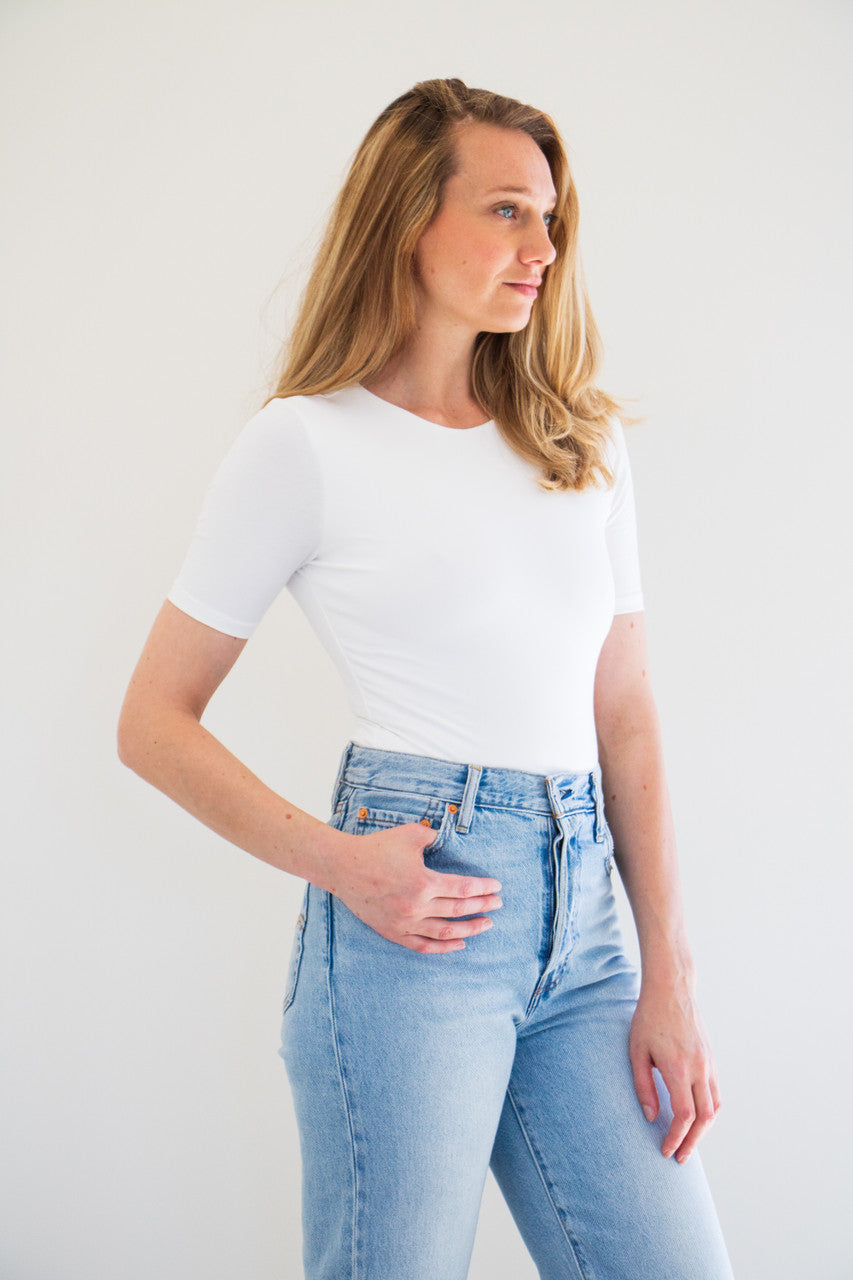 An essential bodysuit with a close fit and lightweight fabric, Pavani features a solid and smooth finish with a crew cut neckline, tee sleeve and just a little bit of stretch.

