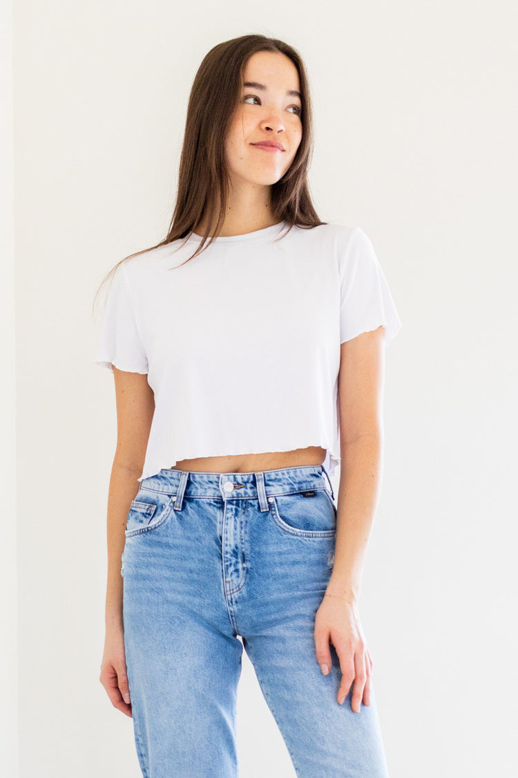 Looking for a versatile and comfortable wardrobe staple? Check out our Chaser Crop Sleeve Tee - made from ultra-soft ribbed fabric with scalloped hemlines, this tee is a must-have for the fashion-conscious. Whether you're dressing it up or down, the Chaser Crop Sleeve Tee is the perfect building block for any outfit.

