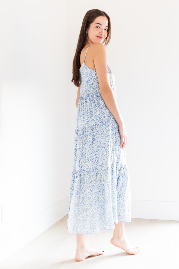 The Priya tiered maxi dress is a stunning addition to any spring wardrobe, with its lightweight fabric and beautiful spring blue print. Its loose and roomy design, along with a boxy neckline and straps, ensure comfort and style all day long.

