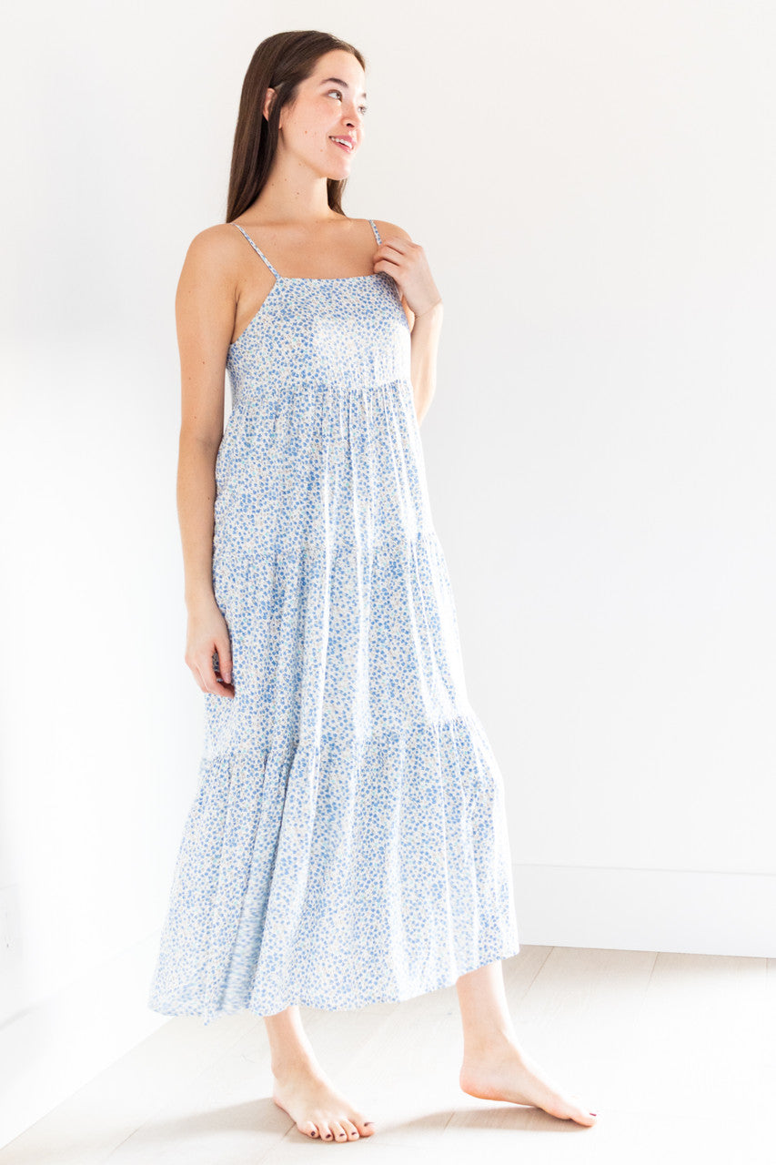 The Priya tiered maxi dress is a stunning addition to any spring wardrobe, with its lightweight fabric and beautiful spring blue print. Its loose and roomy design, along with a boxy neckline and straps, ensure comfort and style all day long.

