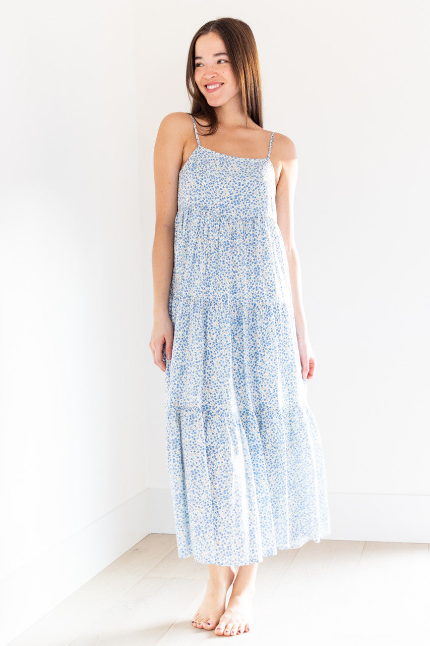 The Priya tiered maxi dress is a stunning addition to any spring wardrobe, with its lightweight fabric and beautiful spring blue print. Its loose and roomy design, along with a boxy neckline and straps, ensure comfort and style all day long.

