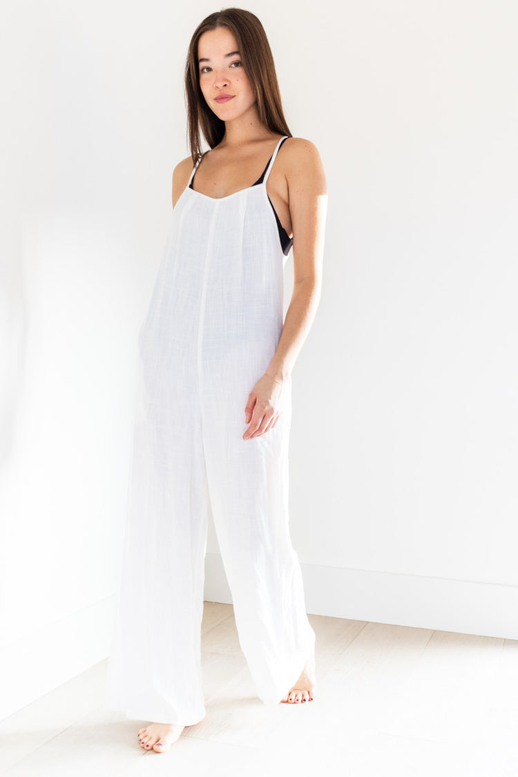 Our 2023 Palm inclusive Elora romper is made from breezy white linen, with a back tie and wide gaucho cut legs - making it the perfect swimwear cover-up. Comfortable and stylish, this romper is designed to fit all body types and enhance your beachside look.

