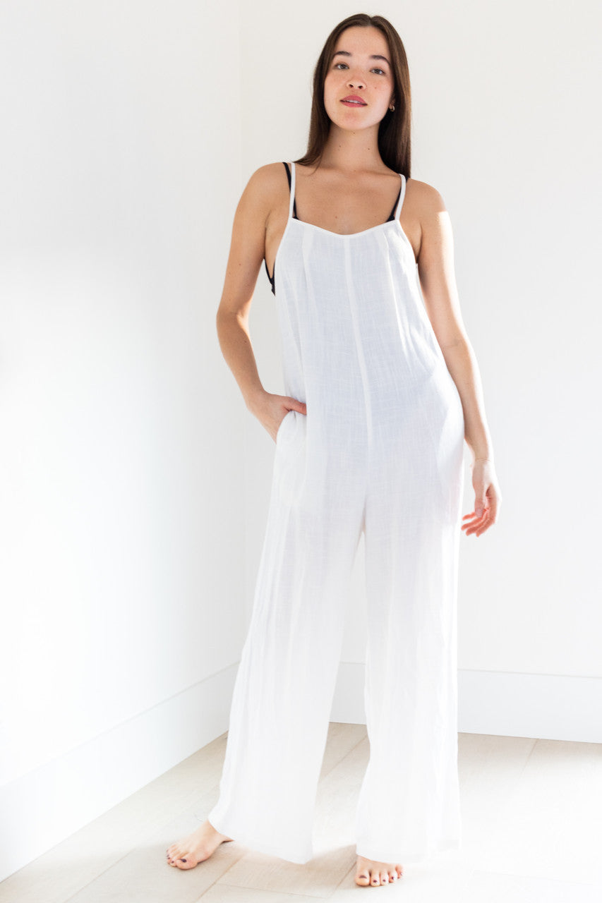 Our 2023 Palm inclusive Elora romper is made from breezy white linen, with a back tie and wide gaucho cut legs - making it the perfect swimwear cover-up. Comfortable and stylish, this romper is designed to fit all body types and enhance your beachside look.

