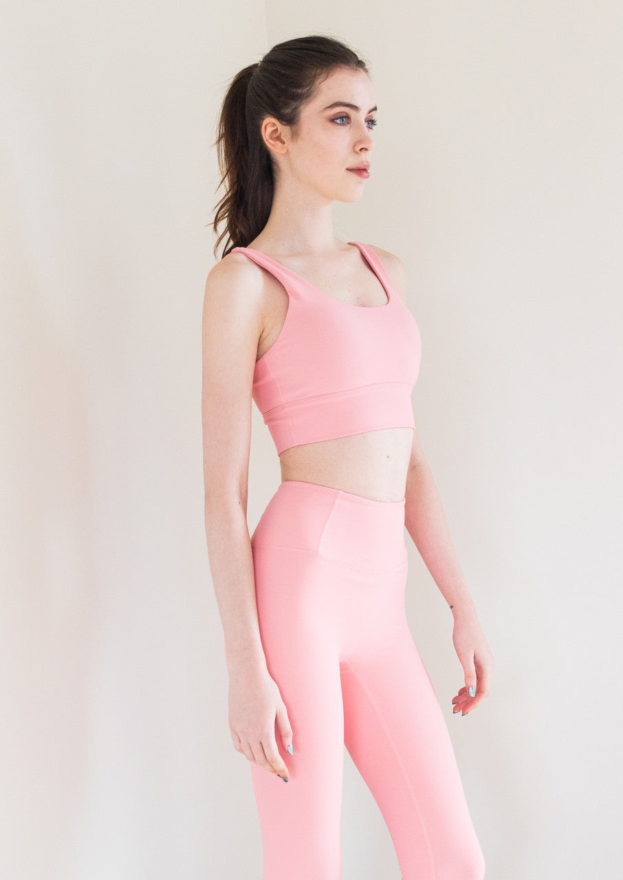 The Royal Ribbed Bra Top in Bubblegum is a stylish and supportive athletic bra top that is perfect for any workout or active lifestyle. It features a grey heather finish, a secure fit, and anti-pill technology, ensuring that it stays looking and feeling great wear after wear.

