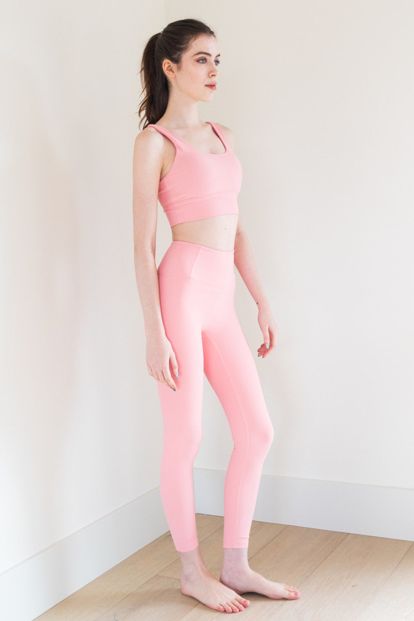 The Ribbed Ultimate Legging in Bubblegum is a high-performance athletic legging that is perfect for any workout or active lifestyle. It features a grey heather finish, a secure fit, and anti-pill technology, ensuring that it stays looking and feeling great wear after wear.

