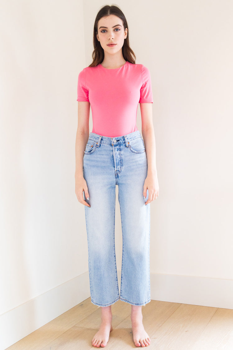 An essential bodysuit with a close fit and lightweight fabric, Pavani features a solid and smooth finish with a crew cut neckline, tee sleeve and just a little bit of stretch.

