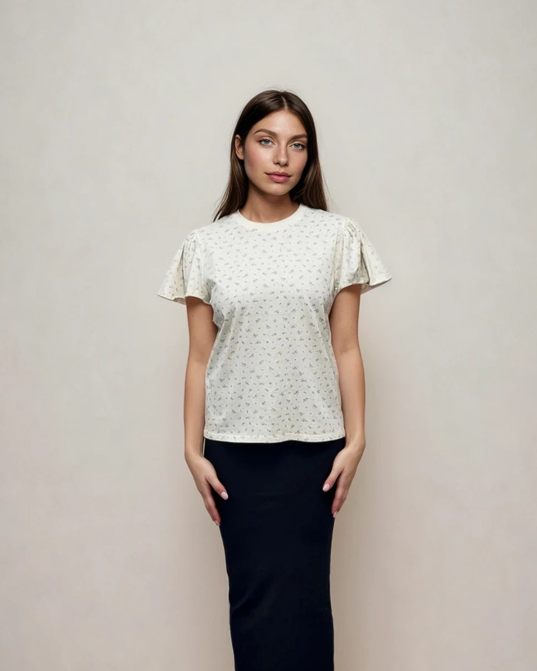 Cream floral tee styled with black Kylie Skirt