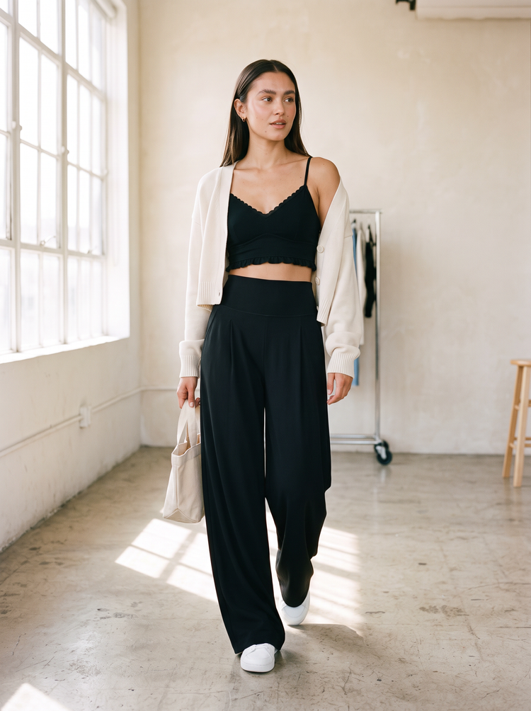 FORM Kansas black wide leg pant styled with Billie sports bra and cream cardigan in a bright studio