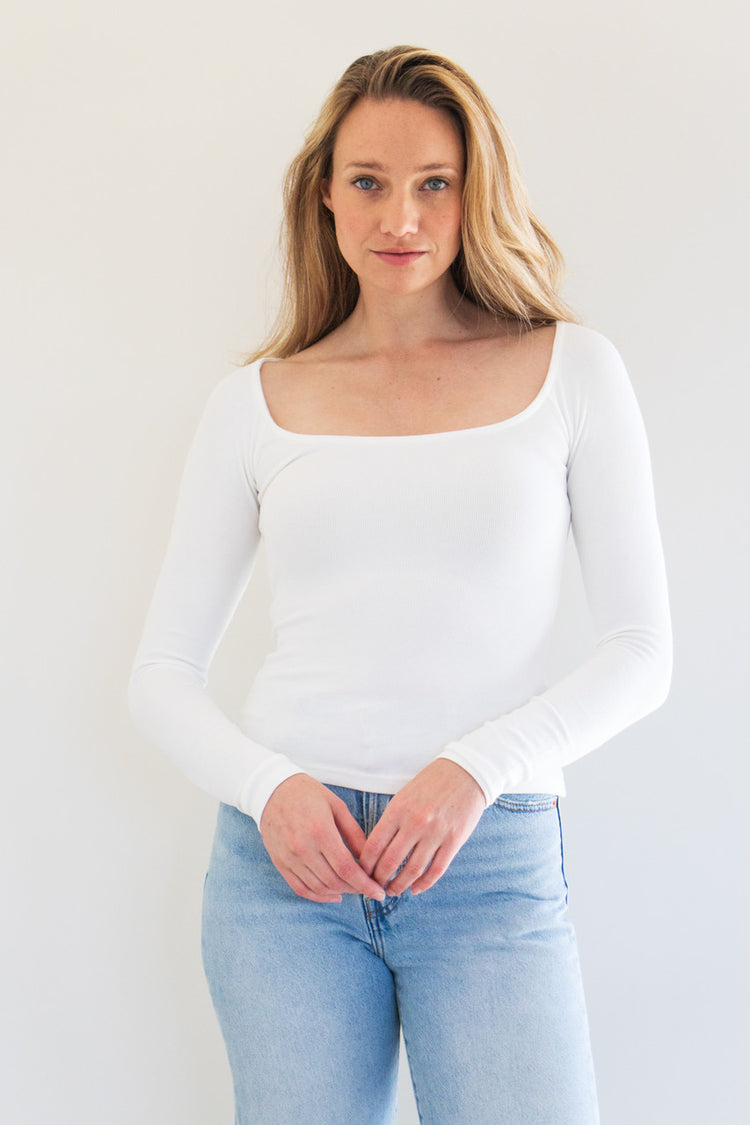 This versatile core basic top is made from a soft ribbed fabric which holds close against your figure, and a clean scoop neckline. A great building block for any outfit, we've paired this top with coats, overalls, and vests.

