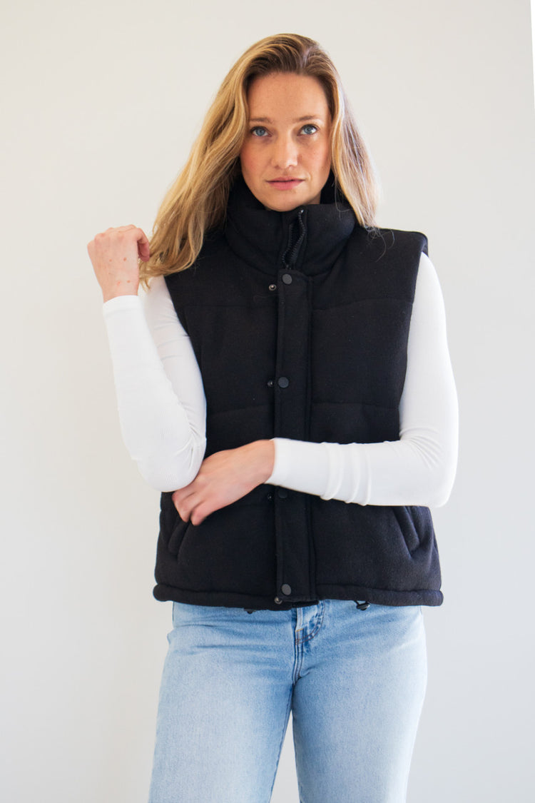 Transition into the cold with The Cora Knit Puffer Vest by PARKE Essentials. Featuring plush fabric, a high-neck rise, and slightly cropped fit, this is not your average winter vest. Available in earthy natural tones Grey, Oat Milk, and Black. 

