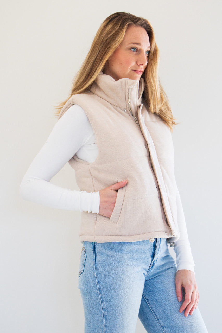 Transition into the cold with The Cora Knit Puffer Vest by PARKE Essentials. Featuring plush fabric, a high-neck rise, and slightly cropped fit, this is not your average winter vest. Available in earthy natural tones Grey, Oat Milk, and Black. 

