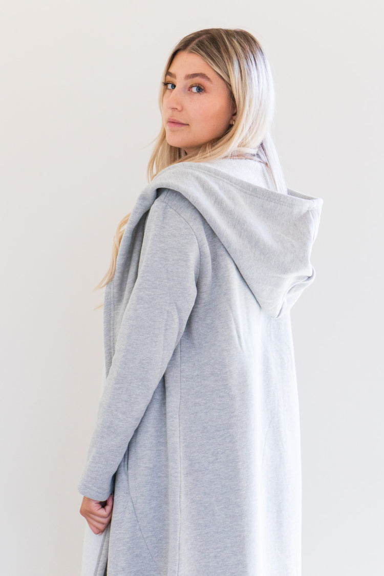 Our luxurious Cloud 9 Cardigan is a custom made full length style with a pocketed cardigan body and reverse fleece hood. Featured in a variety of gentle tones to pair and wear with any of your favourite seasonal pieces - or for lounging in the ultimate comfort at home.