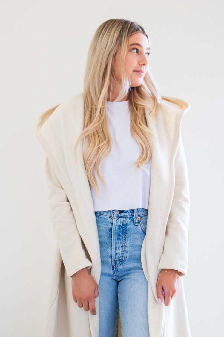 Our luxurious Cloud 9 Cardigan is a custom made full length style with a pocketed cardigan body and reverse fleece hood. Featured in a variety of gentle tones to pair and wear with any of your favourite seasonal pieces - or for lounging in the ultimate comfort at home.