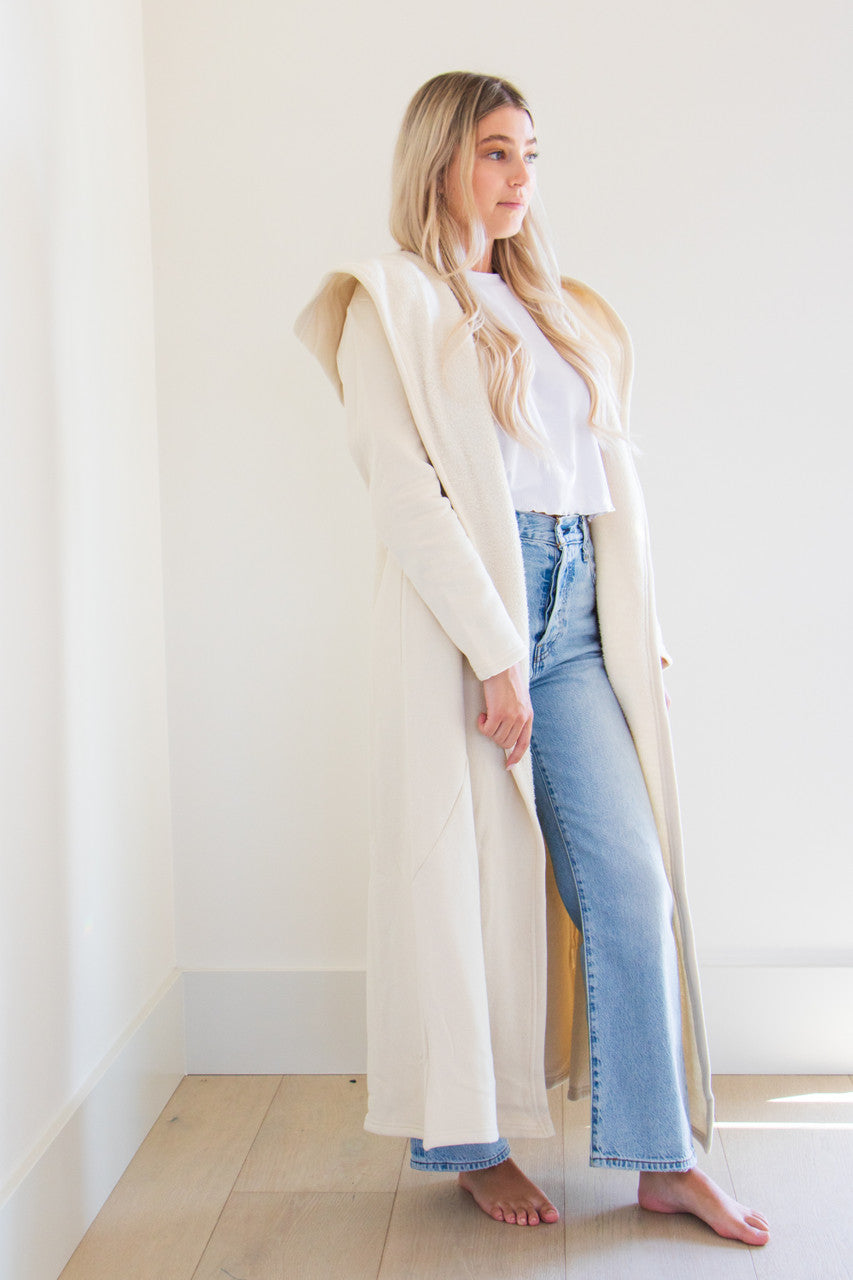 Our luxurious Cloud 9 Cardigan is a custom made full length style with a pocketed cardigan body and reverse fleece hood. Featured in a variety of gentle tones to pair and wear with any of your favourite seasonal pieces - or for lounging in the ultimate comfort at home.