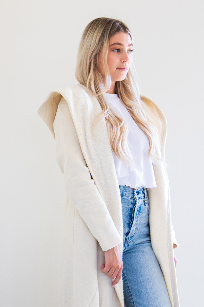 Our luxurious Cloud 9 Cardigan is a custom made full length style with a pocketed cardigan body and reverse fleece hood. Featured in a variety of gentle tones to pair and wear with any of your favourite seasonal pieces - or for lounging in the ultimate comfort at home.