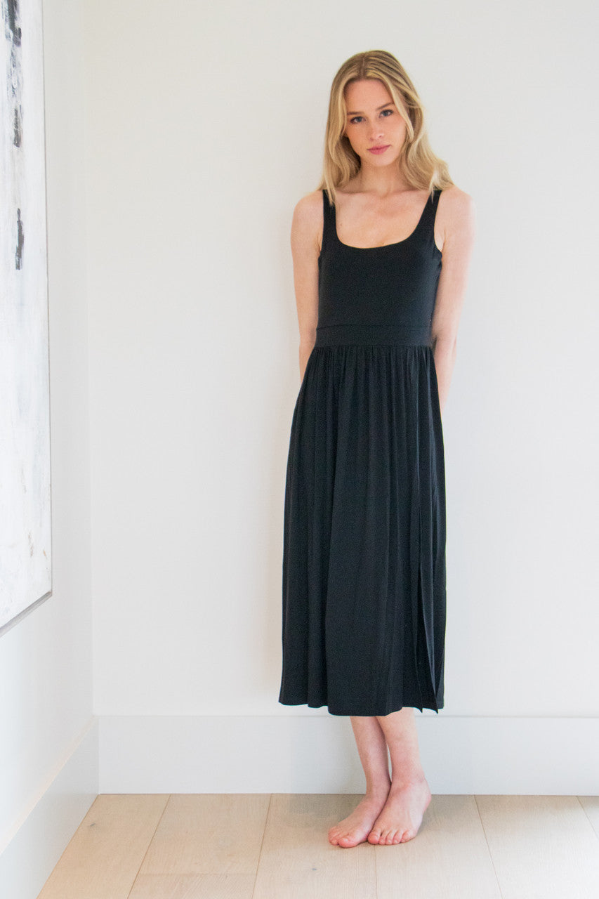 Our best selling summer dress is back in five seasonal colours. Made with a flattering silhouette and scooped neckline, the perfect amount of stretch and a side split to mid thigh. Viscose based fabric has a soft, flowing quality - easy to wear casually and effortless to elevate for something more formal. 
