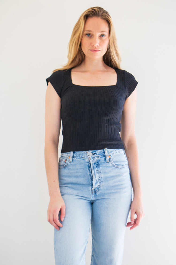 A classic ribbed tee with cap sleeve details and a boxy, squared off neckline. This tee fits true to size with a slightly fitted finish. Made to pair and wear with anything and everything, stock up on staple basics. 

