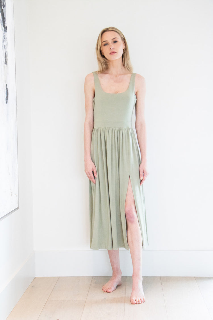 Our best selling summer dress is back in five seasonal colours. Made with a flattering silhouette and scooped neckline, the perfect amount of stretch and a side split to mid thigh. Viscose based fabric has a soft, flowing quality - easy to wear casually and effortless to elevate for something more formal. 
