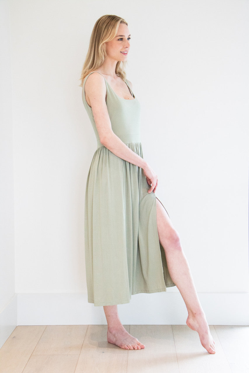 Our best selling summer dress is back in five seasonal colours. Made with a flattering silhouette and scooped neckline, the perfect amount of stretch and a side split to mid thigh. Viscose based fabric has a soft, flowing quality - easy to wear casually and effortless to elevate for something more formal. 
