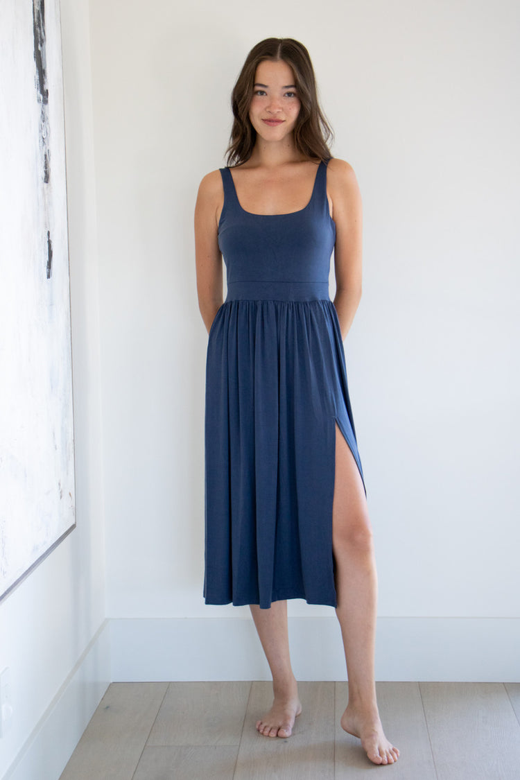 Our best selling summer dress is back in five seasonal colours. Made with a flattering silhouette and scooped neckline, the perfect amount of stretch and a side split to mid thigh. Viscose based fabric has a soft, flowing quality - easy to wear casually and effortless to elevate for something more formal. 
