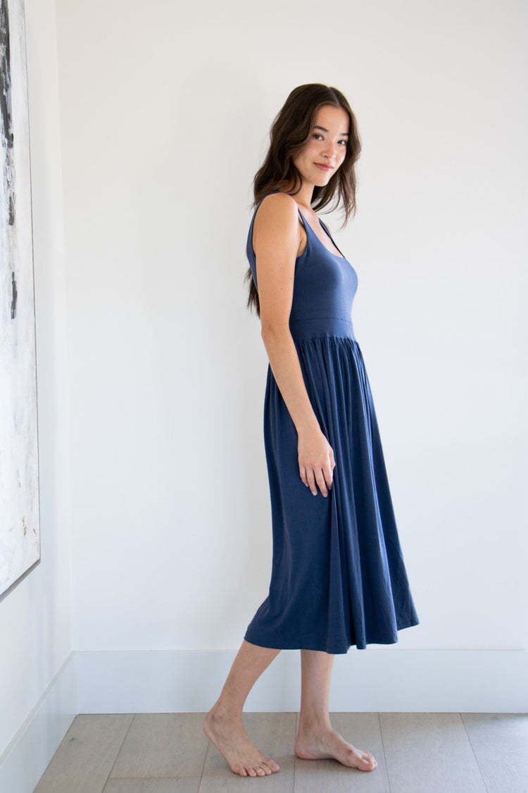 Our best selling summer dress is back in five seasonal colours. Made with a flattering silhouette and scooped neckline, the perfect amount of stretch and a side split to mid thigh. Viscose based fabric has a soft, flowing quality - easy to wear casually and effortless to elevate for something more formal. 
