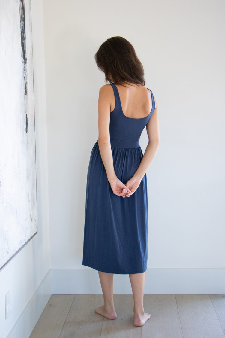 Our best selling summer dress is back in five seasonal colours. Made with a flattering silhouette and scooped neckline, the perfect amount of stretch and a side split to mid thigh. Viscose based fabric has a soft, flowing quality - easy to wear casually and effortless to elevate for something more formal. 
