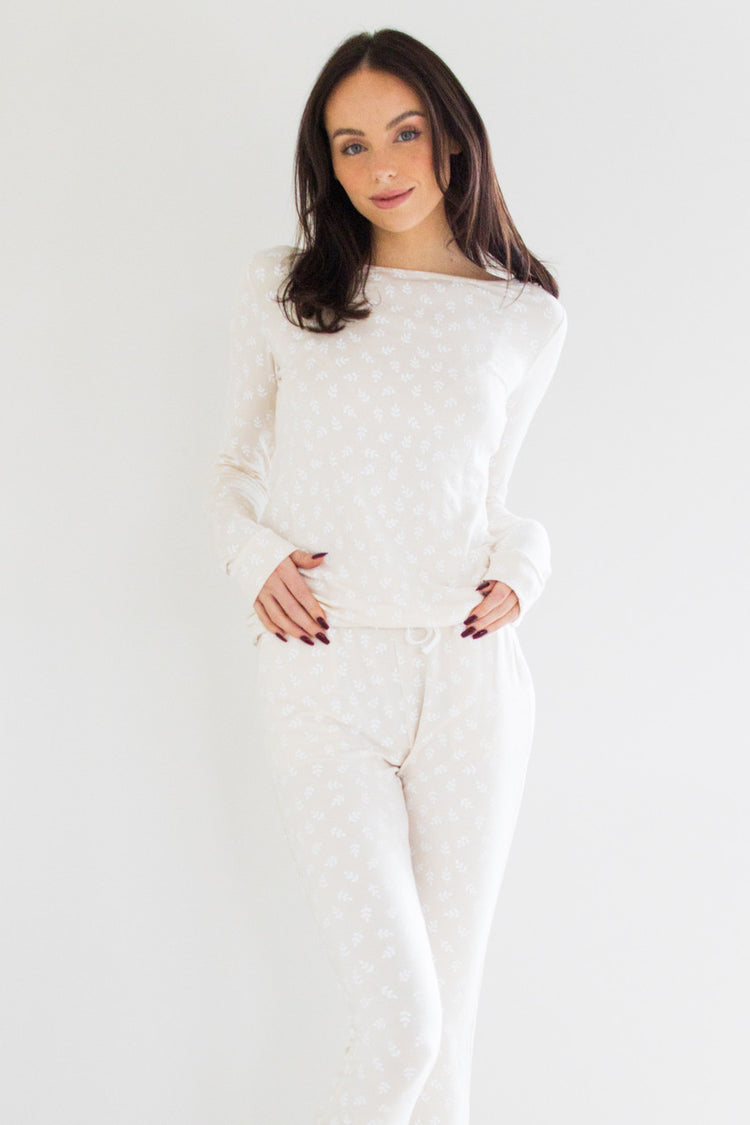 Our best-selling style in our sleepwear apparel collection, the Wildest Dreams Sleep Set is made from our luxurious and comfortable signature sleep fabric. We're keeping it classic with this neutral colour-tone.  The set features a long sleeve boxy pullover crew and tapered ankle length pant with an elasticated cinch waist with an oat print finish.

