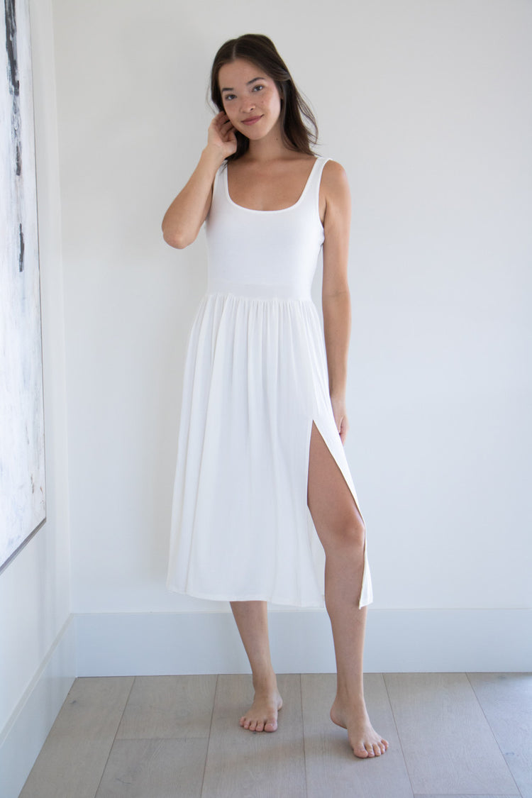 Made with a flattering silhouette and scooped neckline, ribbed chest fabric, the perfect amount of stretch and a side split to mid thigh. Viscose based fabric has a soft, flowing quality - easy to wear casually and effortless to elevate for something more formal. 
