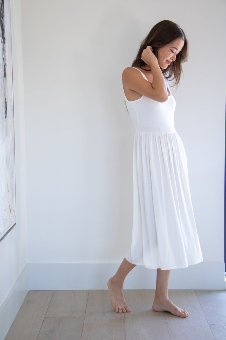Made with a flattering silhouette and scooped neckline, ribbed chest fabric, the perfect amount of stretch and a side split to mid thigh. Viscose based fabric has a soft, flowing quality - easy to wear casually and effortless to elevate for something more formal. 
