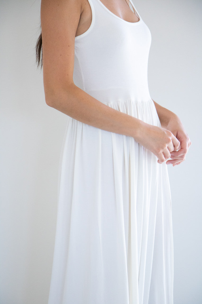 Made with a flattering silhouette and scooped neckline, ribbed chest fabric, the perfect amount of stretch and a side split to mid thigh. Viscose based fabric has a soft, flowing quality - easy to wear casually and effortless to elevate for something more formal. 

