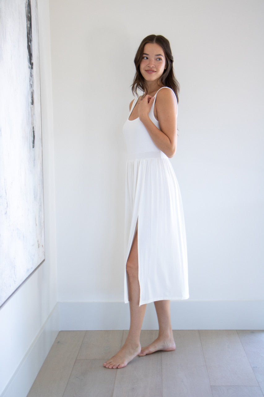 Made with a flattering silhouette and scooped neckline, ribbed chest fabric, the perfect amount of stretch and a side split to mid thigh. Viscose based fabric has a soft, flowing quality - easy to wear casually and effortless to elevate for something more formal. 
