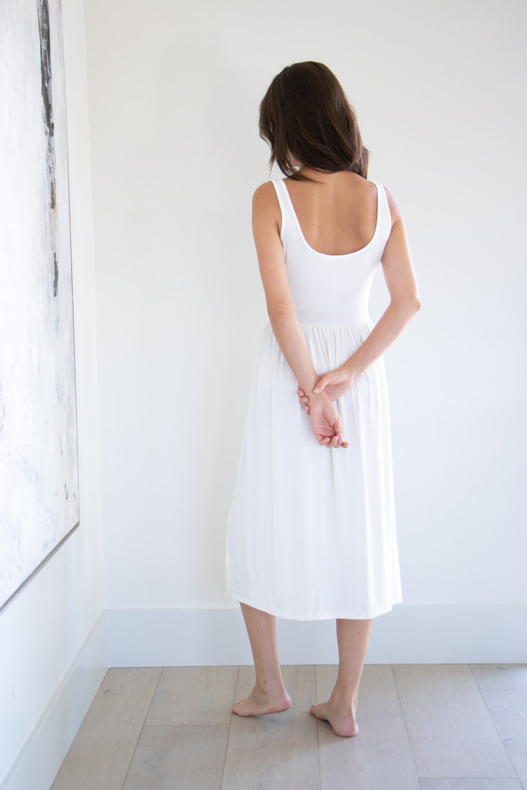 Made with a flattering silhouette and scooped neckline, ribbed chest fabric, the perfect amount of stretch and a side split to mid thigh. Viscose based fabric has a soft, flowing quality - easy to wear casually and effortless to elevate for something more formal. 
