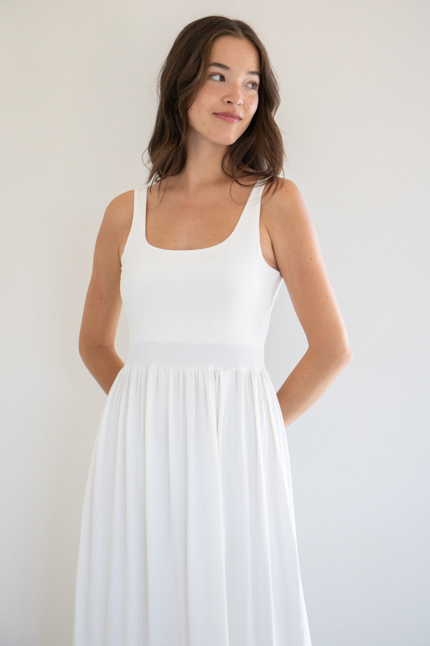 Our best selling summer dress is back in five seasonal colours. Made with a flattering silhouette and scooped neckline, the perfect amount of stretch and a side split to mid thigh. Viscose based fabric has a soft, flowing quality - easy to wear casually and effortless to elevate for something more formal. 
