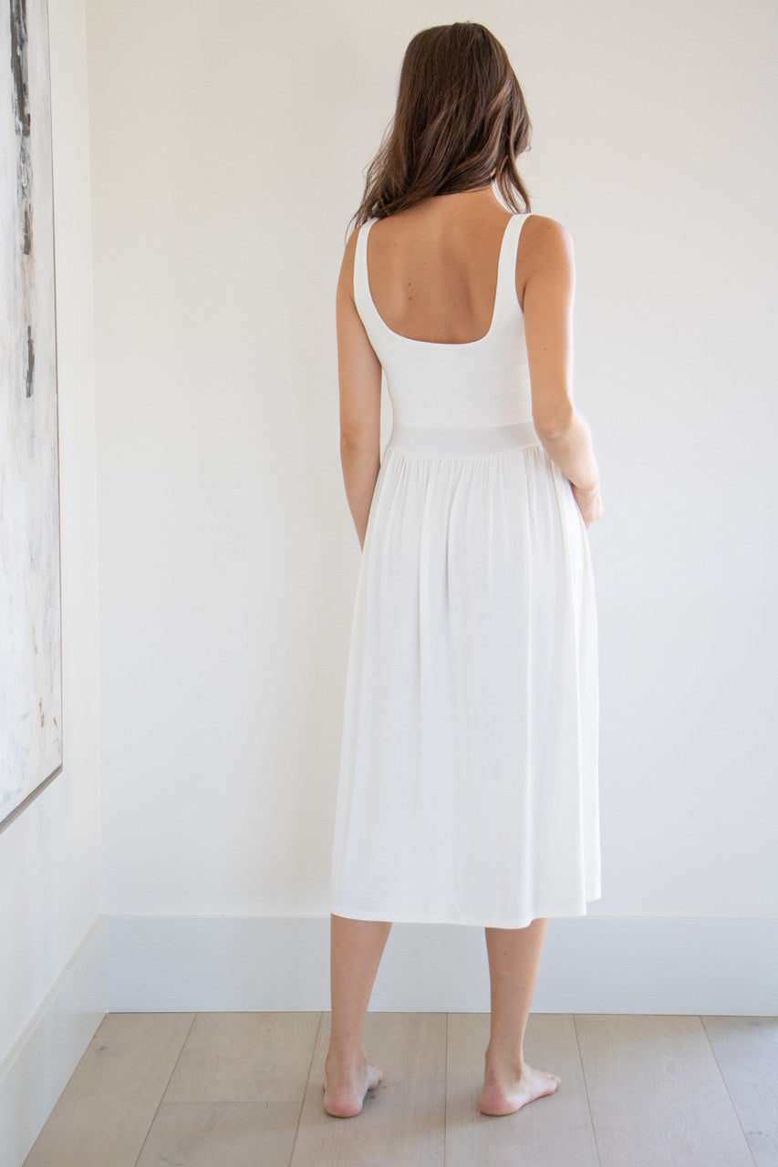 Our best selling summer dress is back in five seasonal colours. Made with a flattering silhouette and scooped neckline, the perfect amount of stretch and a side split to mid thigh. Viscose based fabric has a soft, flowing quality - easy to wear casually and effortless to elevate for something more formal. 
