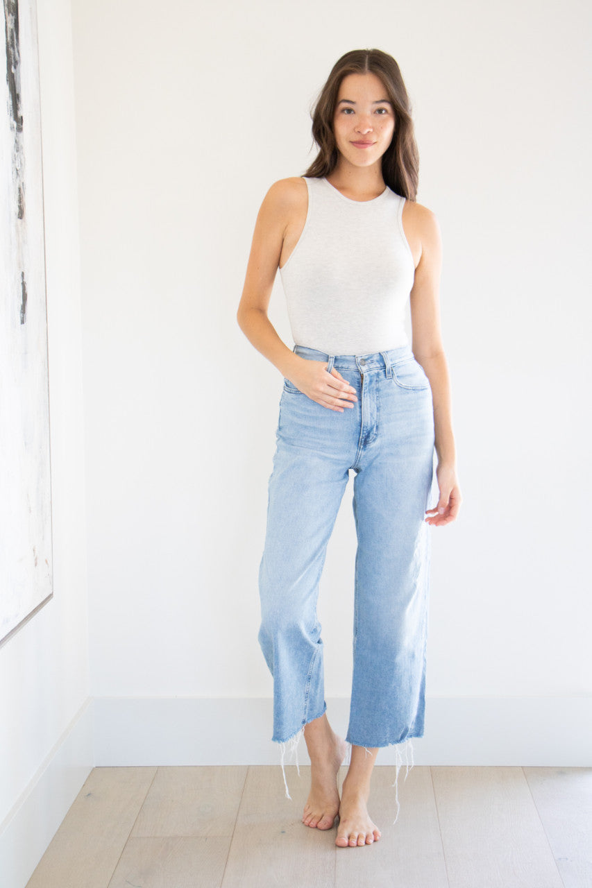 An essential bodysuit with a close fit and lightweight fabric, Holly features a delicate heather finish with a crew cut neckline and just a little bit of stretch. Pair and wear with anything effortlessly, or style with our Farrah linen wrap skirts for a cute, seasonal ready look. 

