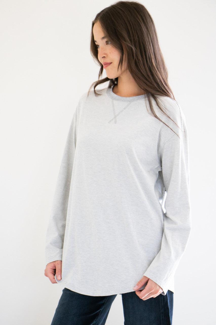 No exaggeration here; this is the ultimate long sleeve tee. Fitting loose on your frame with a drop-shoulder design and a gentle curve at the hem, this essential piece is effortless to pair and wear, with simple care instructions and understated details throughout. Monikered with the PRIV seal between the shoulder-blades. 

