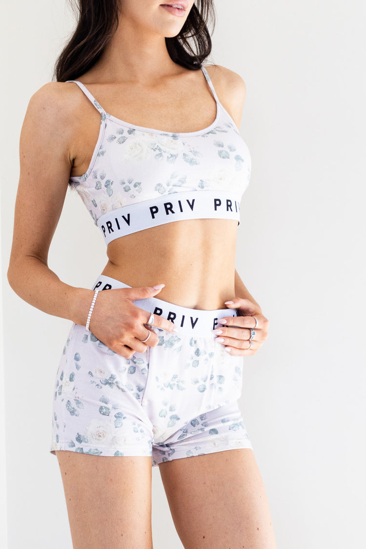 Playful and minimalist, this feminine intimates set is a two piece structured bra-top, paired with a lounge-able, boyfriend style boxer. Made in our beautiful White Rose Print and created from ultra-soft fabric with our monikered band - we promise you will fall in love with these.
