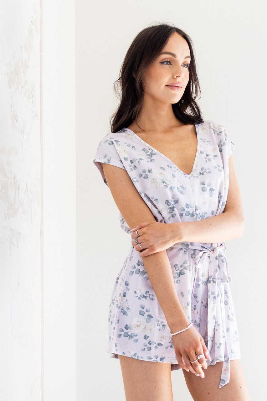 Introducing our white rose print women's romper, made from soft lilac modal fabric. Featuring a tie waist and delicate floral pattern, this romper is both comfortable and stylish. Perfect for any occasion, dress it up or down for a versatile addition to your wardrobe. 
