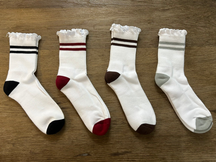 PRIV Stripe Ruffle Top Socks flat lay in Black, Wine, Espresso and Grey – white ribbed crew sock with ruffle cuff and two stripes