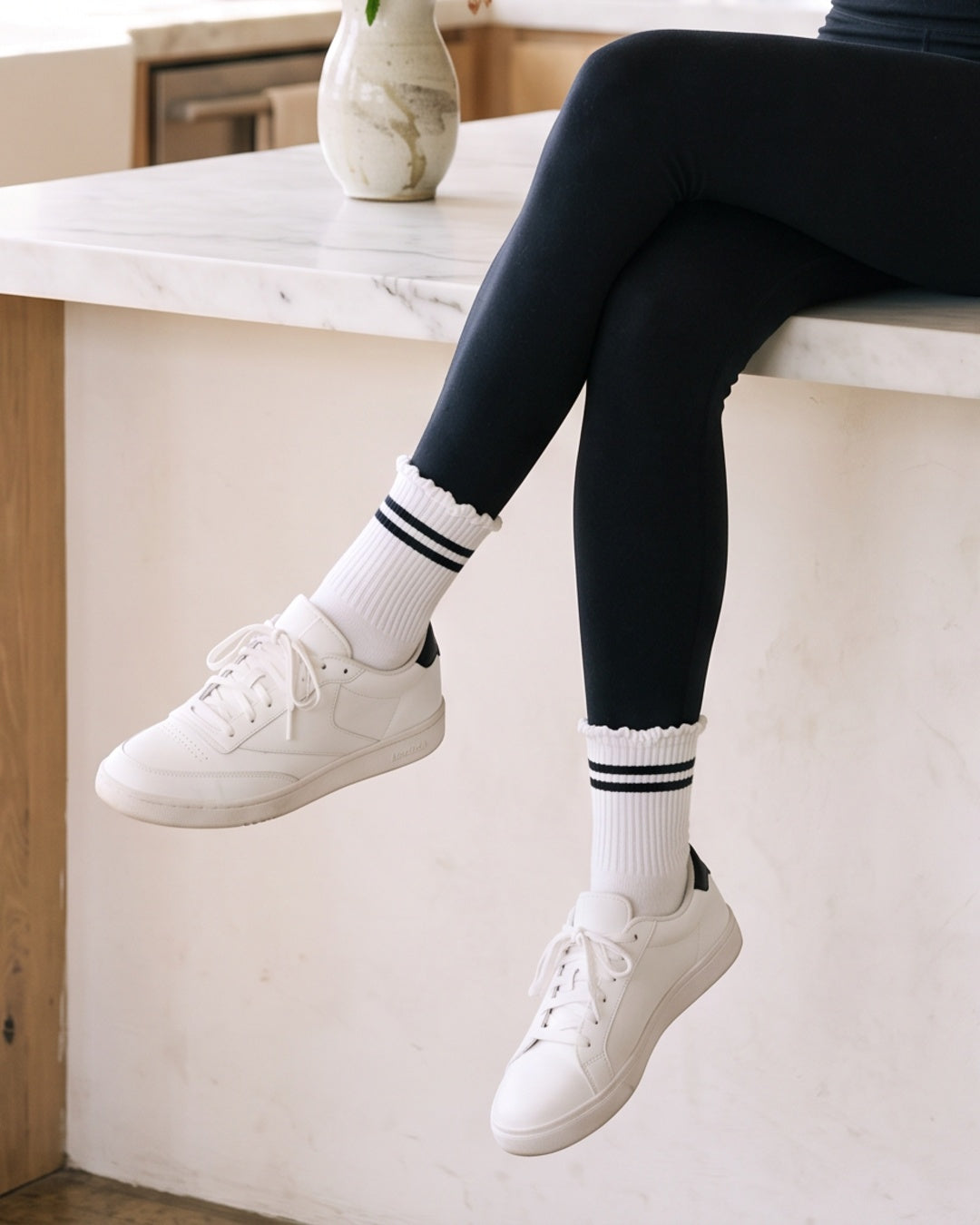 Stripe Ruffle Top Socks in Black worn with white sneakers – PRIV