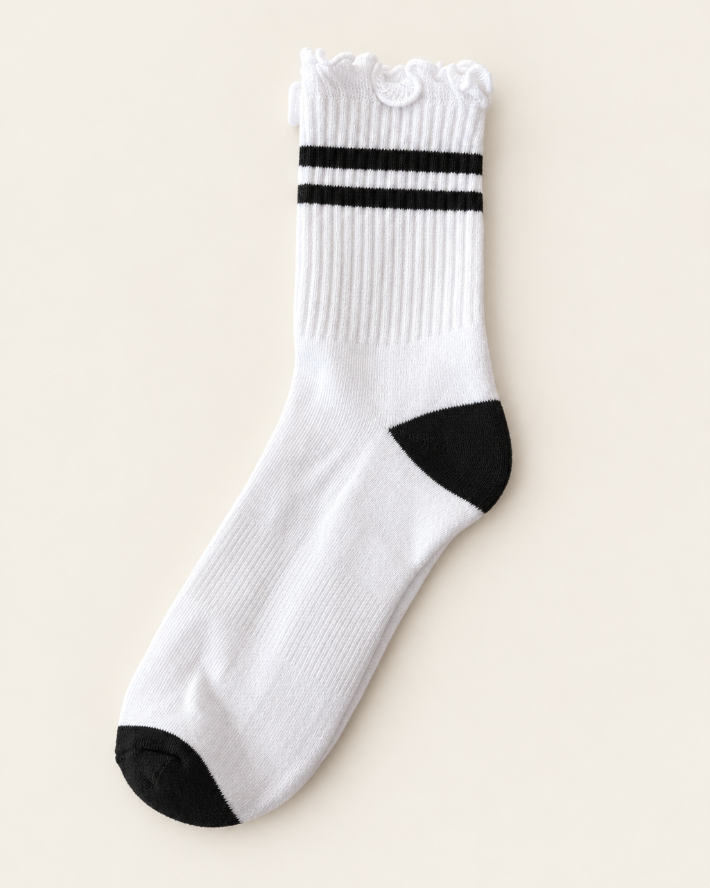 Stripe ruffle top PRIV sock in black – white ribbed crew sock with black stripes, flat lay