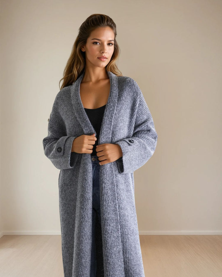 Meet the Vera Coatigan—where cozy comfort meets modern polish. Crafted in a soft, textured knit with a straight, relaxed fit, Vera is the versatile layer your wardrobe has been waiting for. The open-front design drapes effortlessly, while button-cuff detailing on the sleeves adds a refined touch.